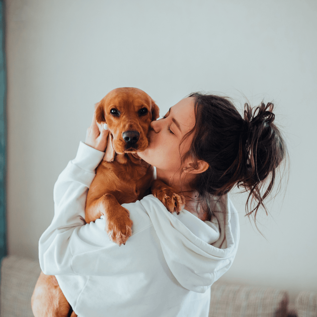 Lady and her difficult to train dog share an intimate moment.